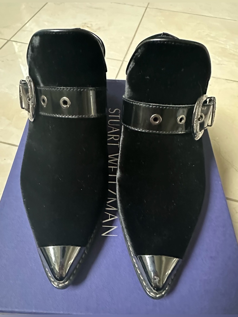Stuart Weitzman’s “Scootin” Black Velvet Pointed Mules with Silver Buckle